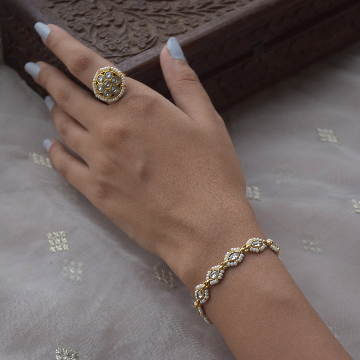 Gajra Bracelet crafted with intricate Jadau stones and delicate pearls, blending traditional Indian floral gajra motifs with modern elegance.