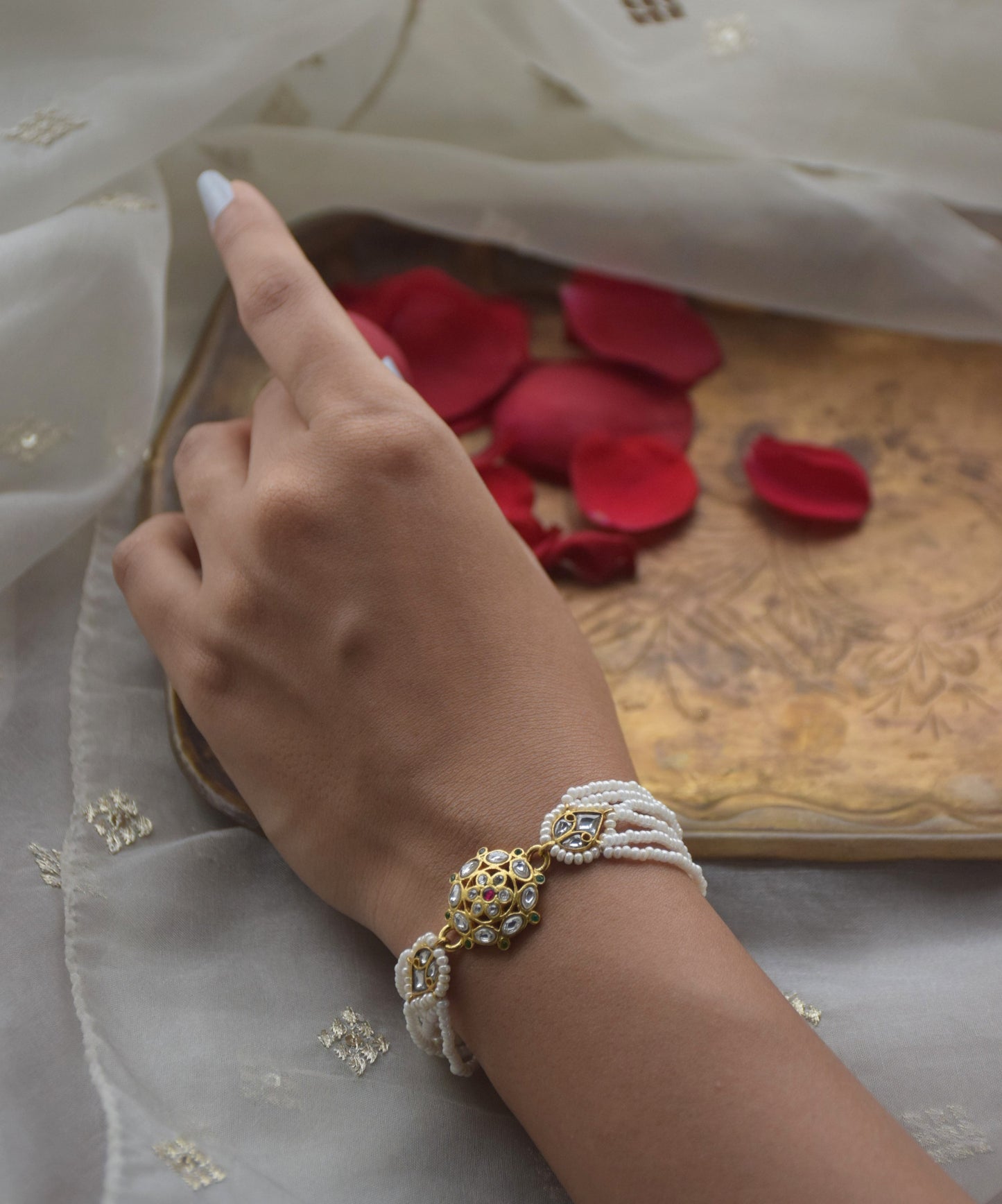 Ranisa Bracelet, a meticulously crafted accessory designed to complement traditional Indian attire with elegant charm.