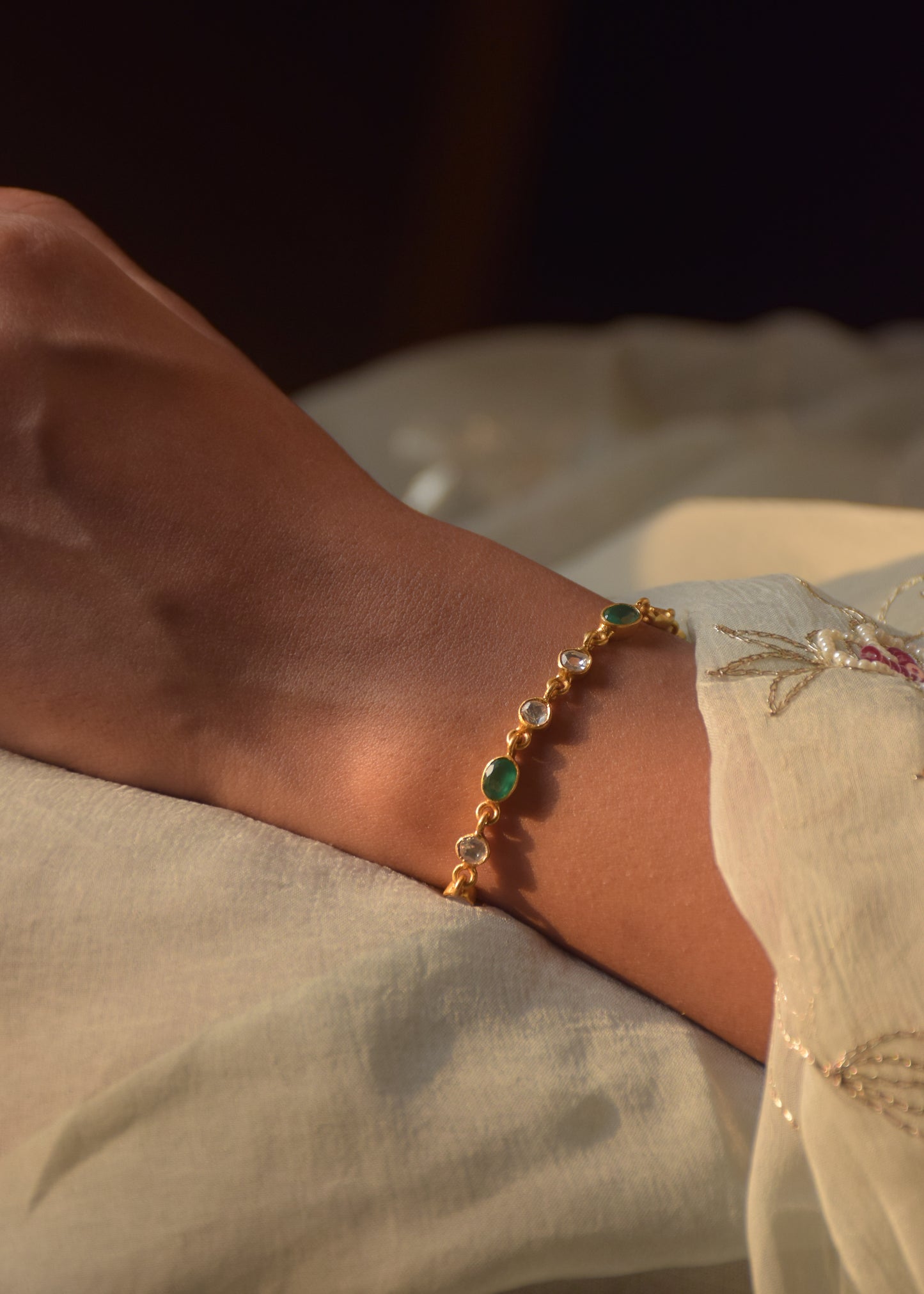Saira Bracelet crafted in 925 silver, featuring sparkling polki stones and green onyx set in an open samosa design.