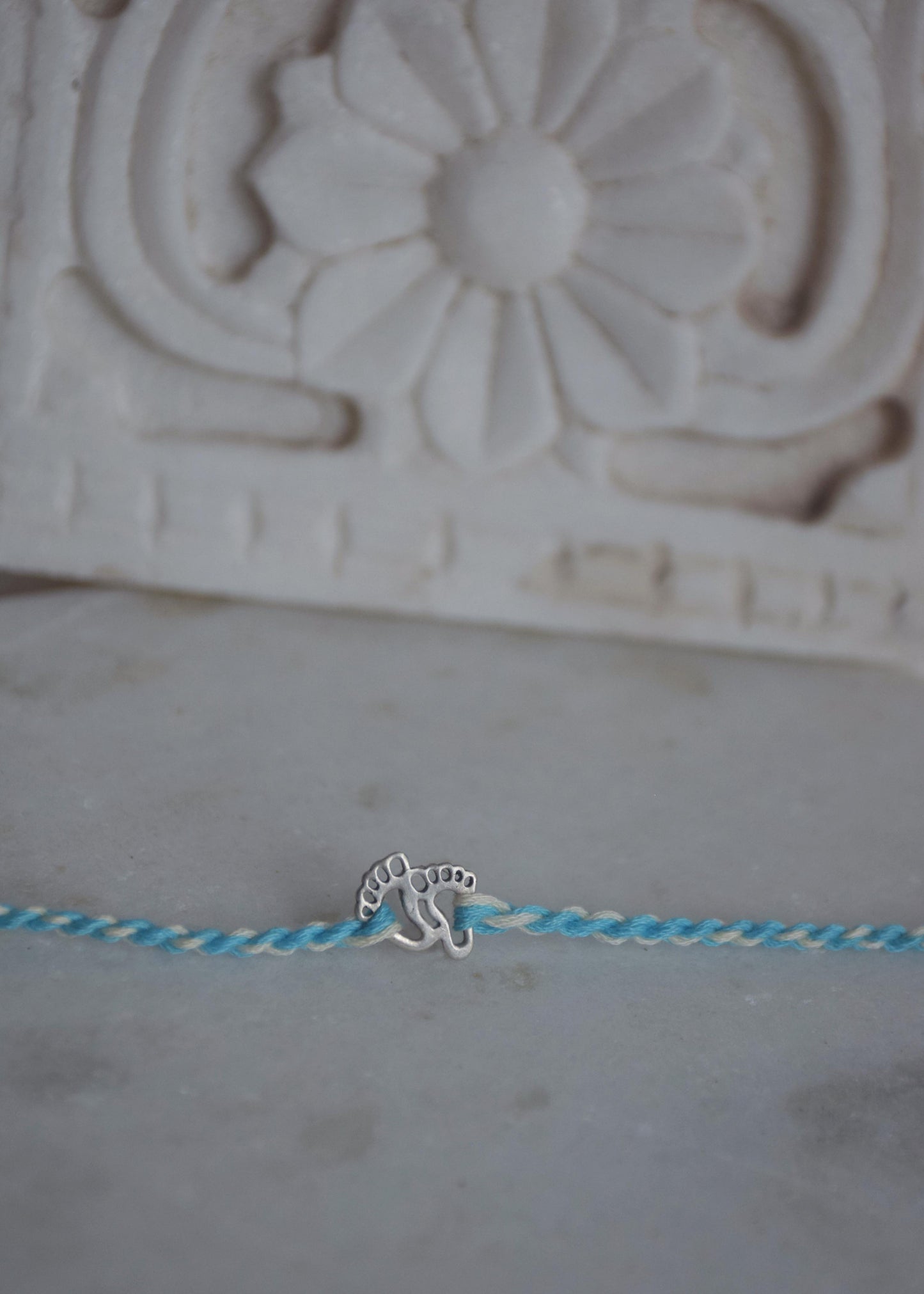 925 sterling silver kids rakhi with cute baby feet design