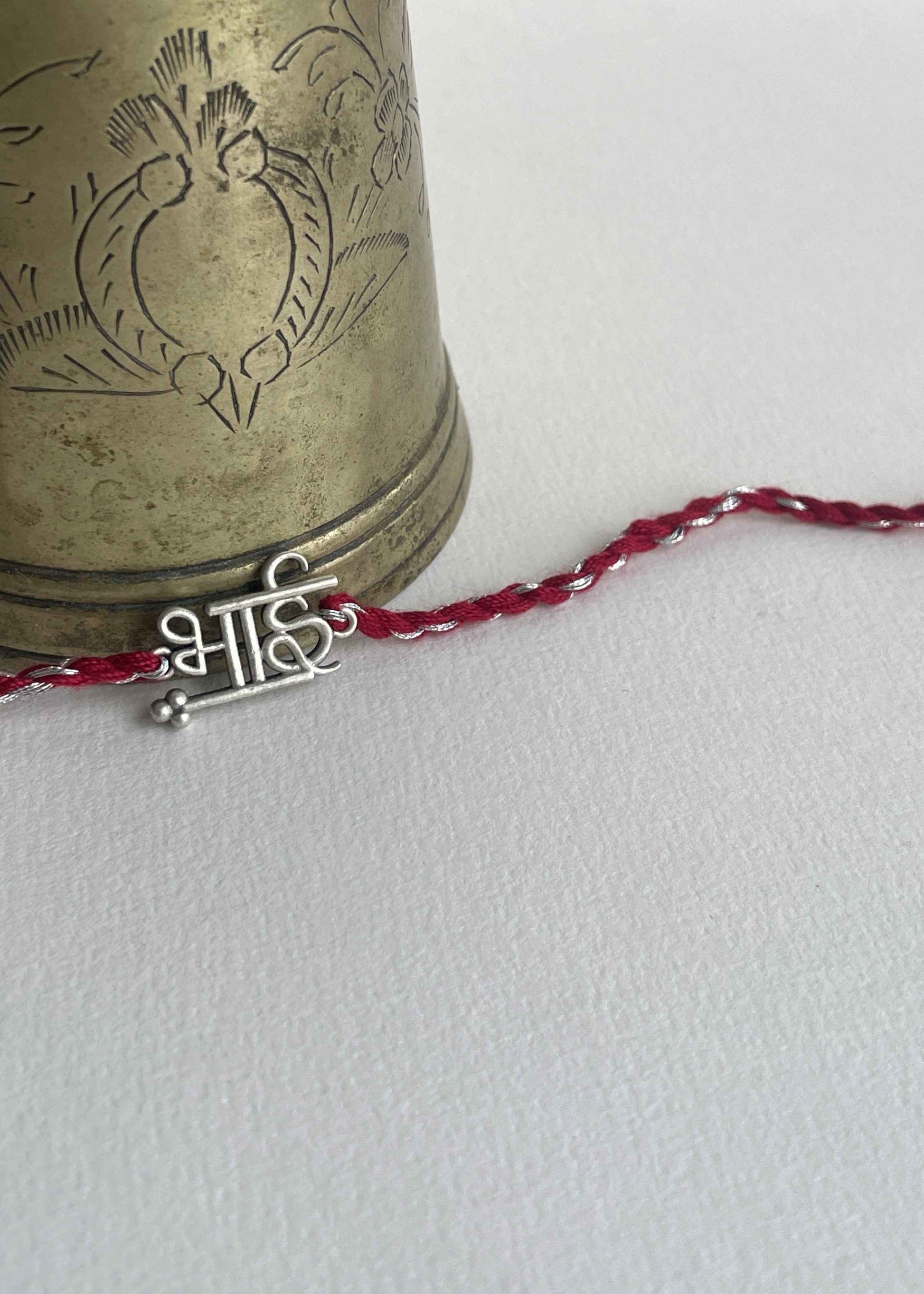 Beautiful 92.5 sterling silver Rakhi crafted with sterling silver and cotton thread