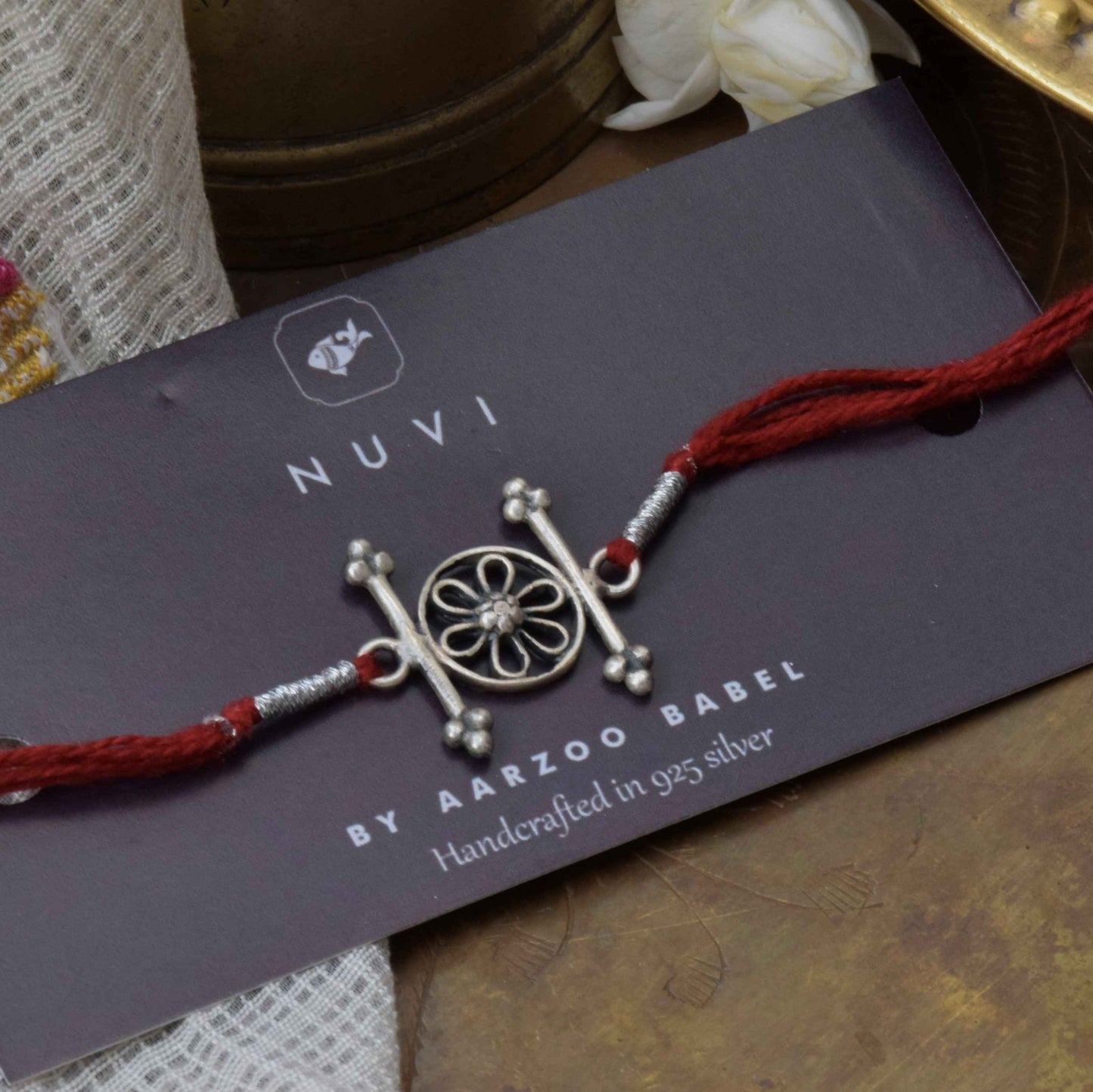 Handcrafted Flower sterling silver rakhi by Nuvi Jewels