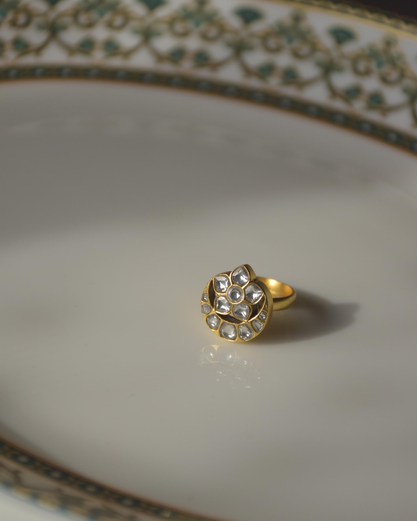 Chand Sitara ring crafted in 925 sterling silver with 22K gold plating, featuring a traditional crescent motif and exquisite jadau stones.