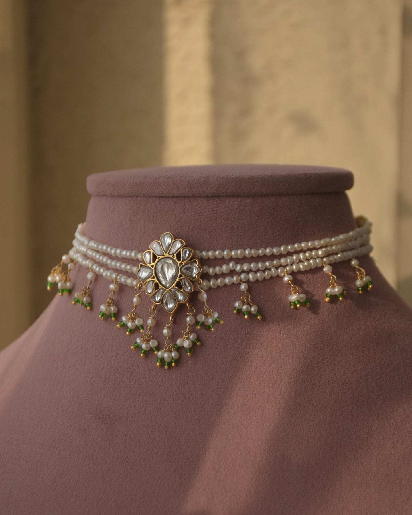 Charu choker necklace in 92.5 sterling silver, featuring a delicate floral motif with white Jadau stones and freshwater pearls.