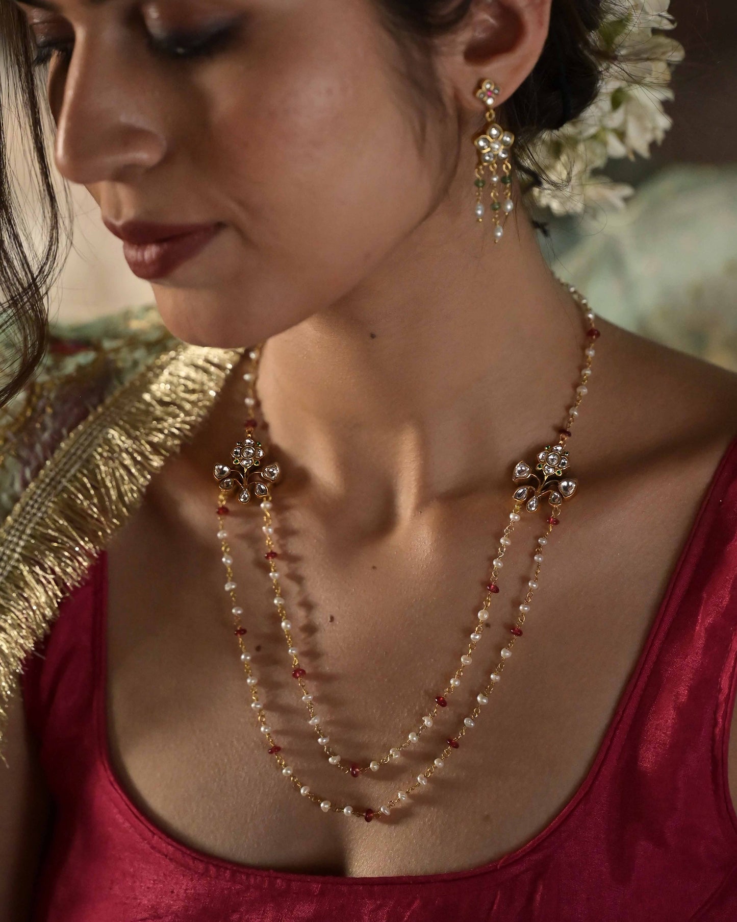 Chowkhat Necklace in gold polished 925 silver featuring delicate freshwater pearls, pink bead accents, and floral motifs with white jadau stones.