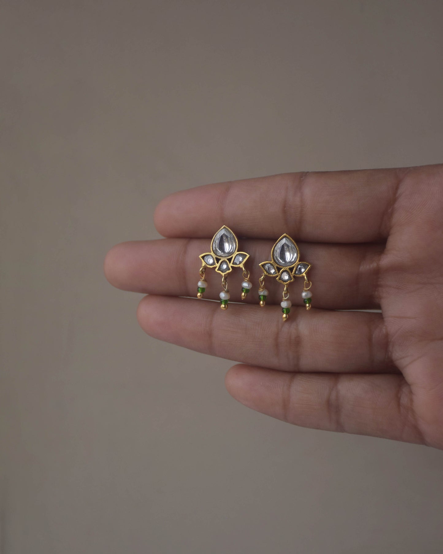 Nuvi Jewels small jadau earstuds in 925 silver with gold plating and freshwater pearl accents