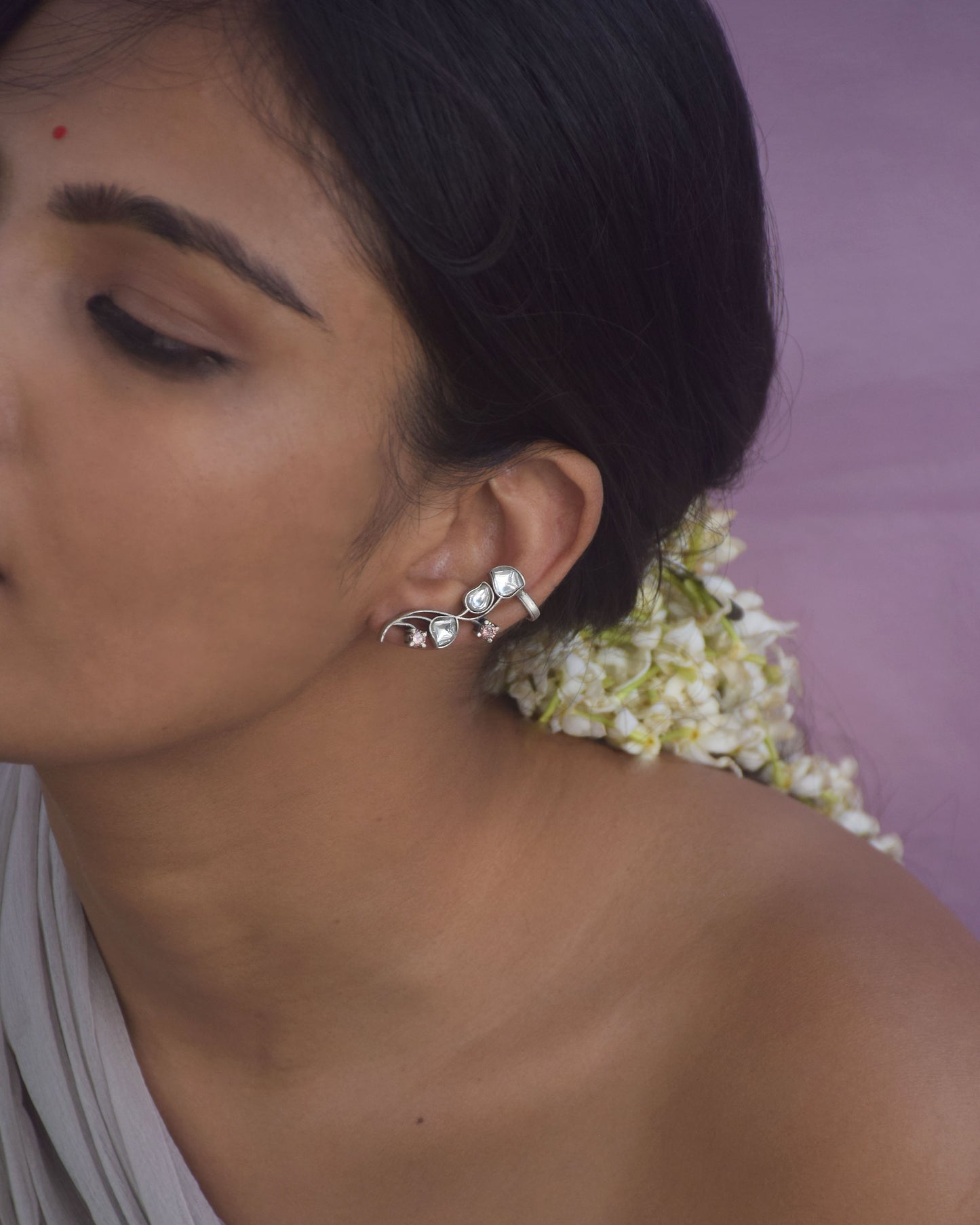 Kumudini Earcuffs in 92.5 sterling silver, inspired by the Kumudini flower, featuring delicate floral motifs and a secure clip for a comfortable fit