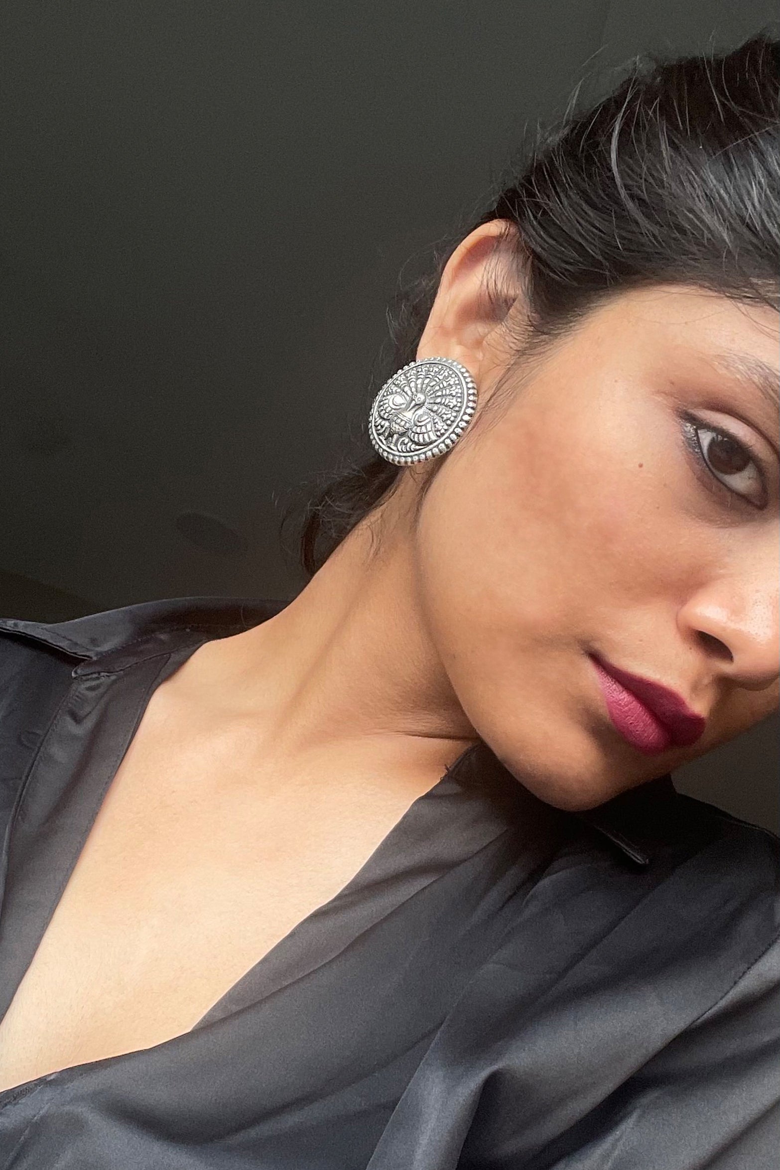 Mora Chappai oxidized silver earstuds – elegant handcrafted earrings ideal for casual wear, perfect for pairing with a classic white shirt.