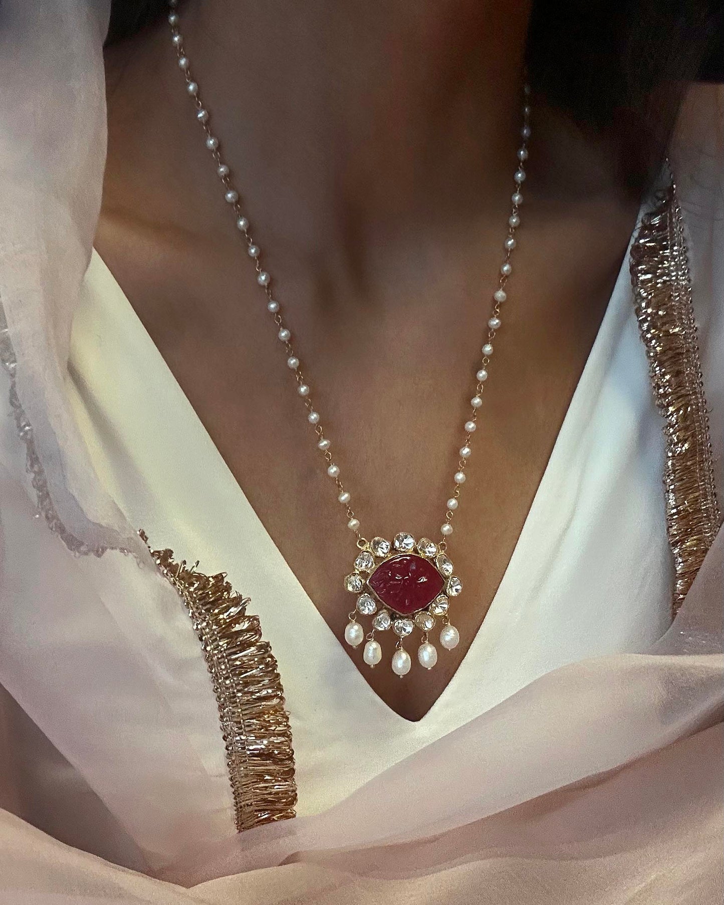 Elegant Nuvi Jewels polki pendant featuring a pink glass stone in sterling silver with pearl chain
