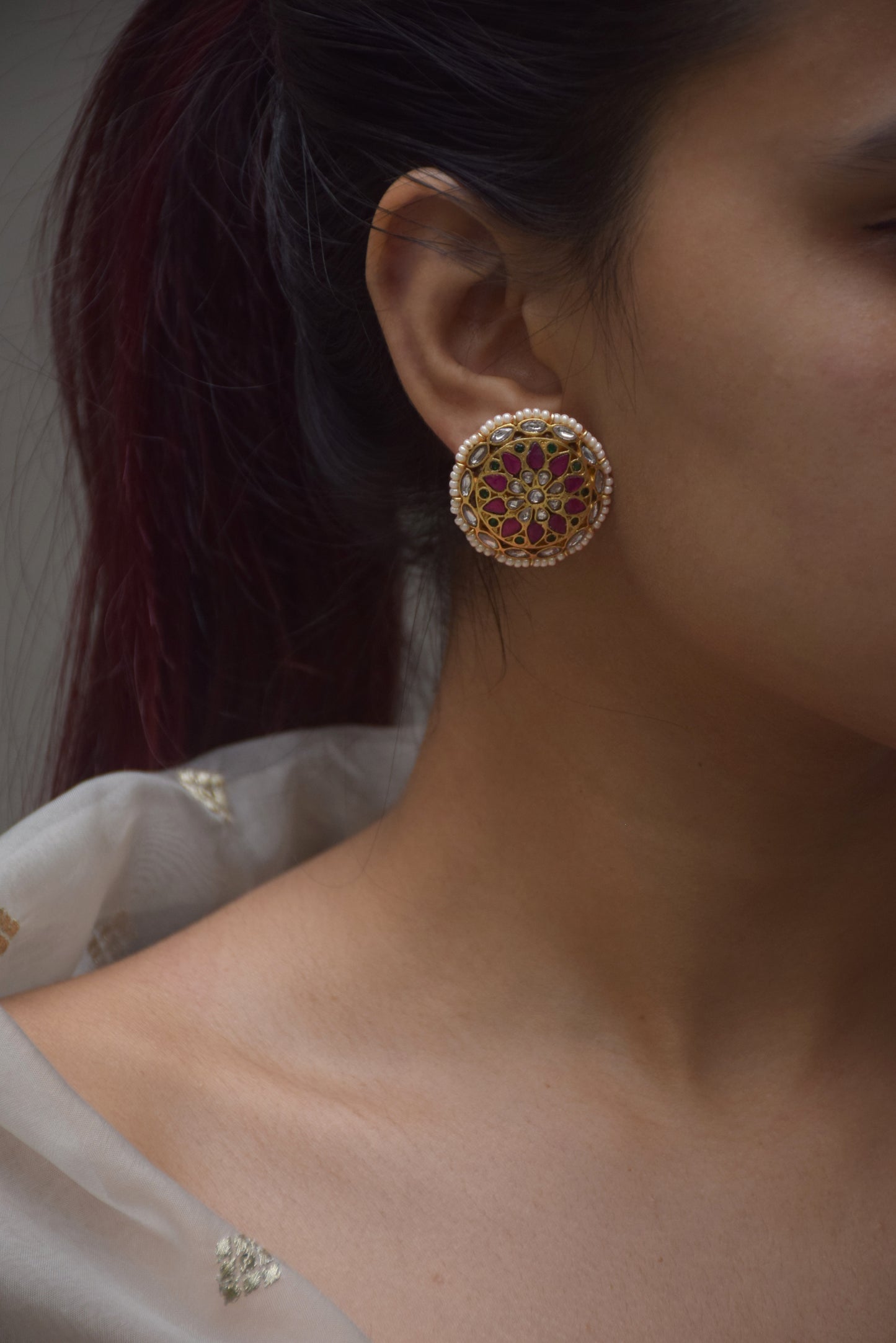 Nuvi Jewels Ranisa Earstuds, gold-polished 925 silver with round Jadau motif and delicate pearl framing, lightweight and elegant for ethnic and festive styling.