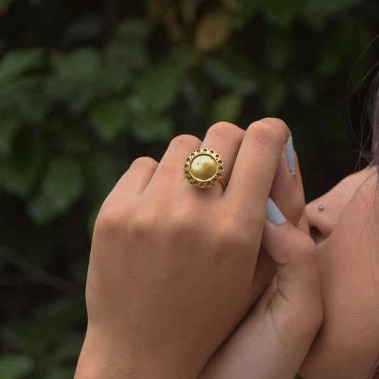 Preet ring featuring delicate golden hues and an intricate flower motif.