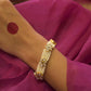 Jogini Bracelet handcrafted in 925 silver, featuring elaborate floral motifs embellished with white Jadau stones and finished with delicate seed pearl piroi.