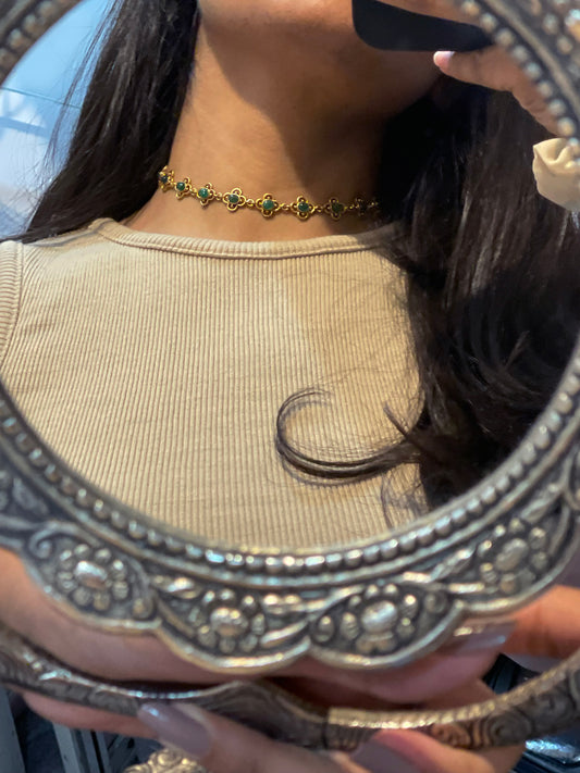  Kamini Choker crafted in 925 silver with 22k gold plating, featuring delicate green aventurine stones surrounded by intricate gold jali work in a floral design.