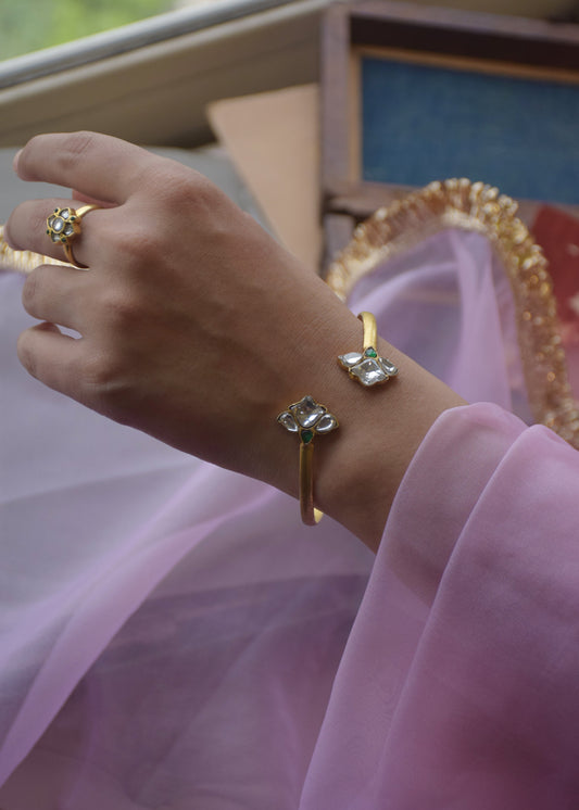 Nuvi Flower Bangle crafted in 925 silver with radiant gold polish.