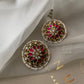 Ranisa Earstuds handcrafted in 925 silver with gold polish, featuring a round motif of traditional Jadau stones and a delicate pearl border.