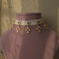 Ruhani Polki Choker handcrafted in 92.5 sterling silver with gold plating, featuring round floral motifs adorned with hand-set Polki stones using the traditional samosa daak technique. Delicate petal-shaped Polki drops add graceful movement.