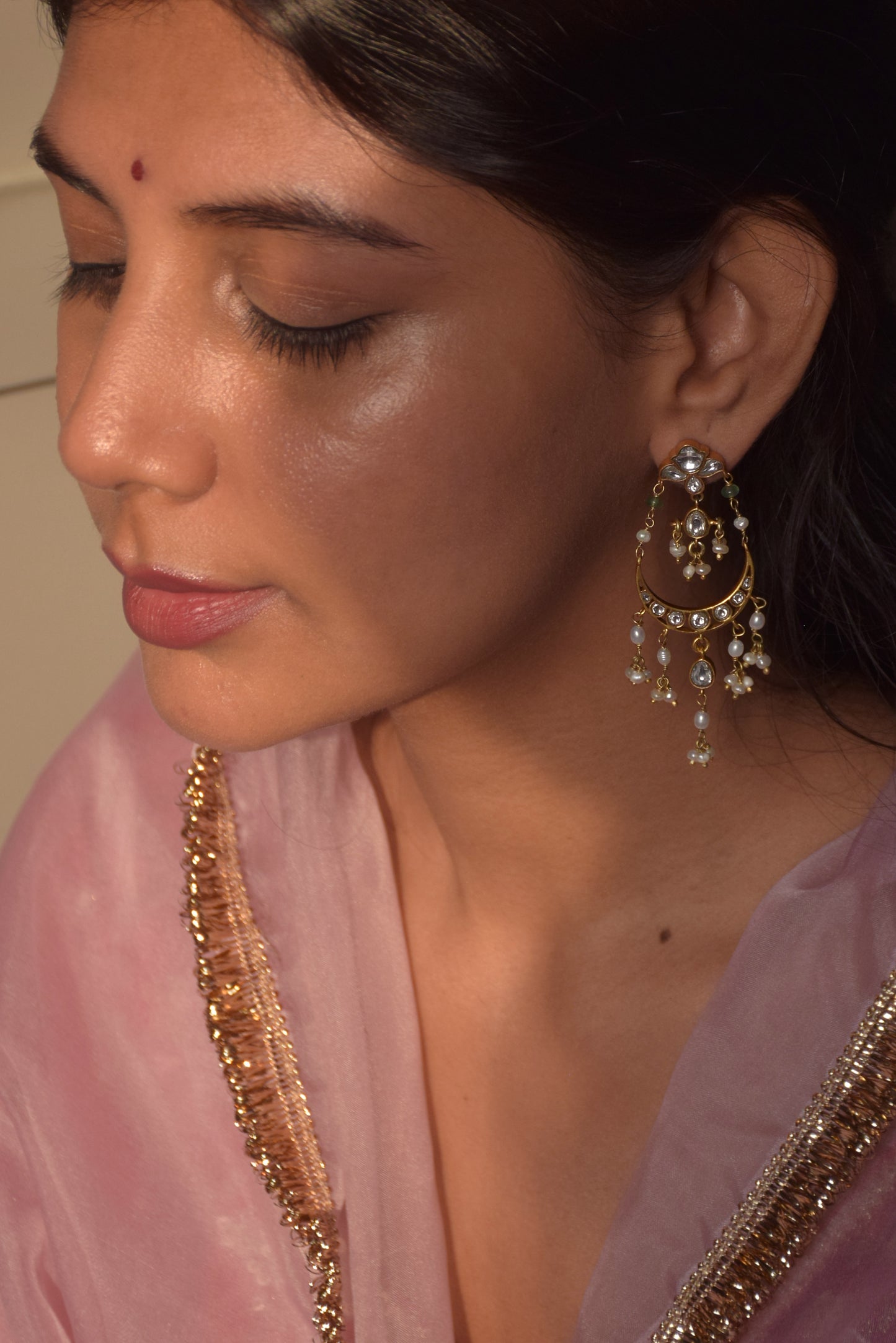 Saadgi Chandbali Earrings crafted in 925 silver, featuring floral studs embellished with Jadau stones connected to intricately designed chand-shaped drops. Finished with hanging clusters of freshwater rice pearls.