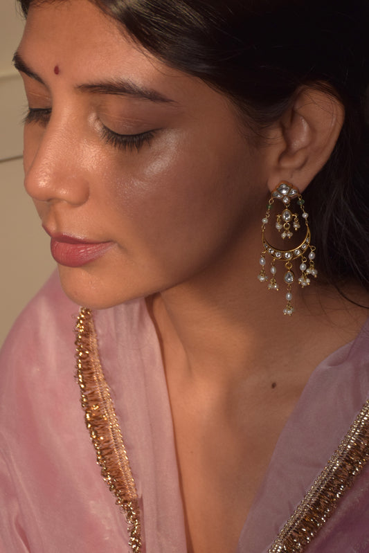 Saadgi Chandbali Earrings crafted in 925 silver, featuring floral studs embellished with Jadau stones connected to intricately designed chand-shaped drops. Finished with hanging clusters of freshwater rice pearls.