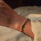 Saira Bracelet crafted in 925 silver, featuring sparkling polki stones and green onyx set in an open samosa design. 