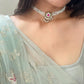 Chand Phool Choker crafted in 925 silver with radiant gold polish, featuring a classic chand unit adorned with a jadau flower centerpiece, framed by elegant lines of pearls.
