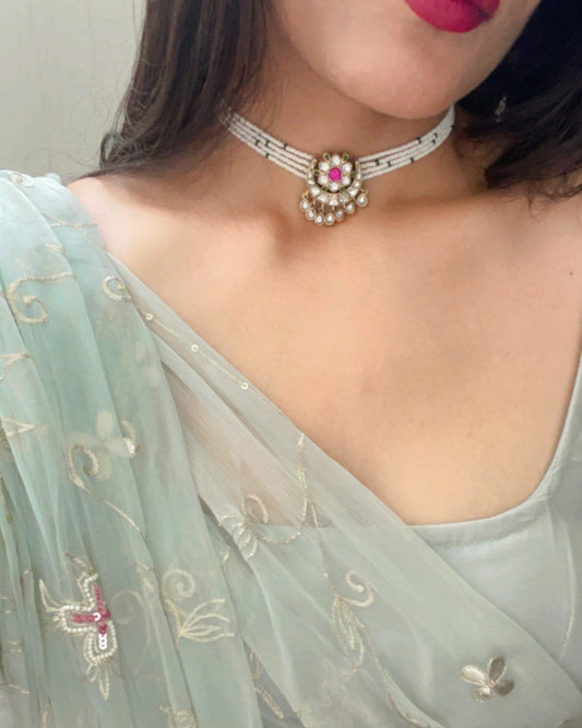 Chand Phool Choker crafted in 925 silver with radiant gold polish, featuring a classic chand unit adorned with a jadau flower centerpiece, framed by elegant lines of pearls.
