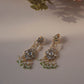 Jadau Pearl Drop Earrings crafted in 925 sterling silver featuring a flower-shaped top studded with jadau stones and an intricate jadau stone-studded motif suspended from three strands of pearls.