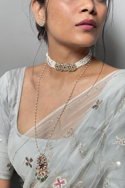 Phirni Choker crafted in 925 silver with a gold-polished finish, featuring three round Jadau stone units as the centerpiece and delicate strands of seed pearls