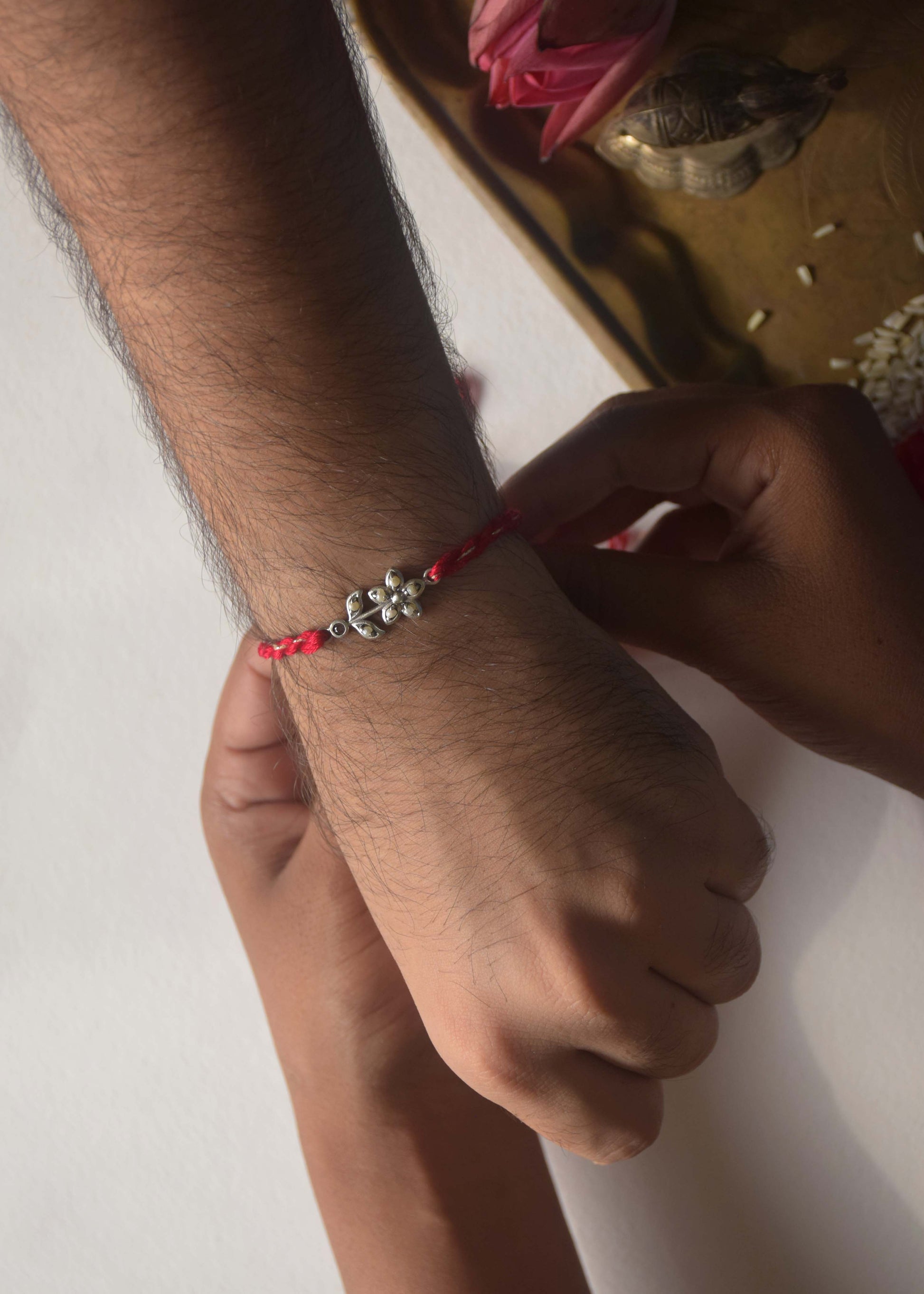 925 Silver Pearl Flower Rakhi – Wrist Shot | NUVI Jewels