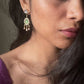  stunning Jadau stone-studded earstuds and a captivating aventurine stone suspended within delicate white Jadau petal work. Handcrafted from 925 Silver.