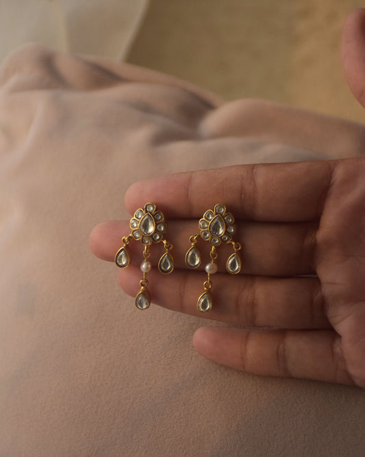 Madhuri earrings are a delicate pair crafted in 92.5 silver, featuring stunning jadau stones. 
