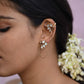 Menaka Earcuffs crafted in 92.5 sterling silver, featuring two floral motifs connected by cascading silver chains with a secure clip.