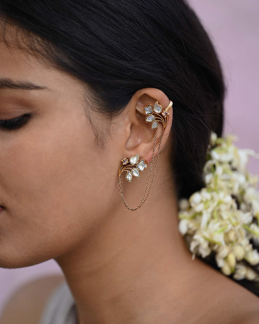 Menaka Earcuffs crafted in 92.5 sterling silver, featuring two floral motifs connected by cascading silver chains with a secure clip.