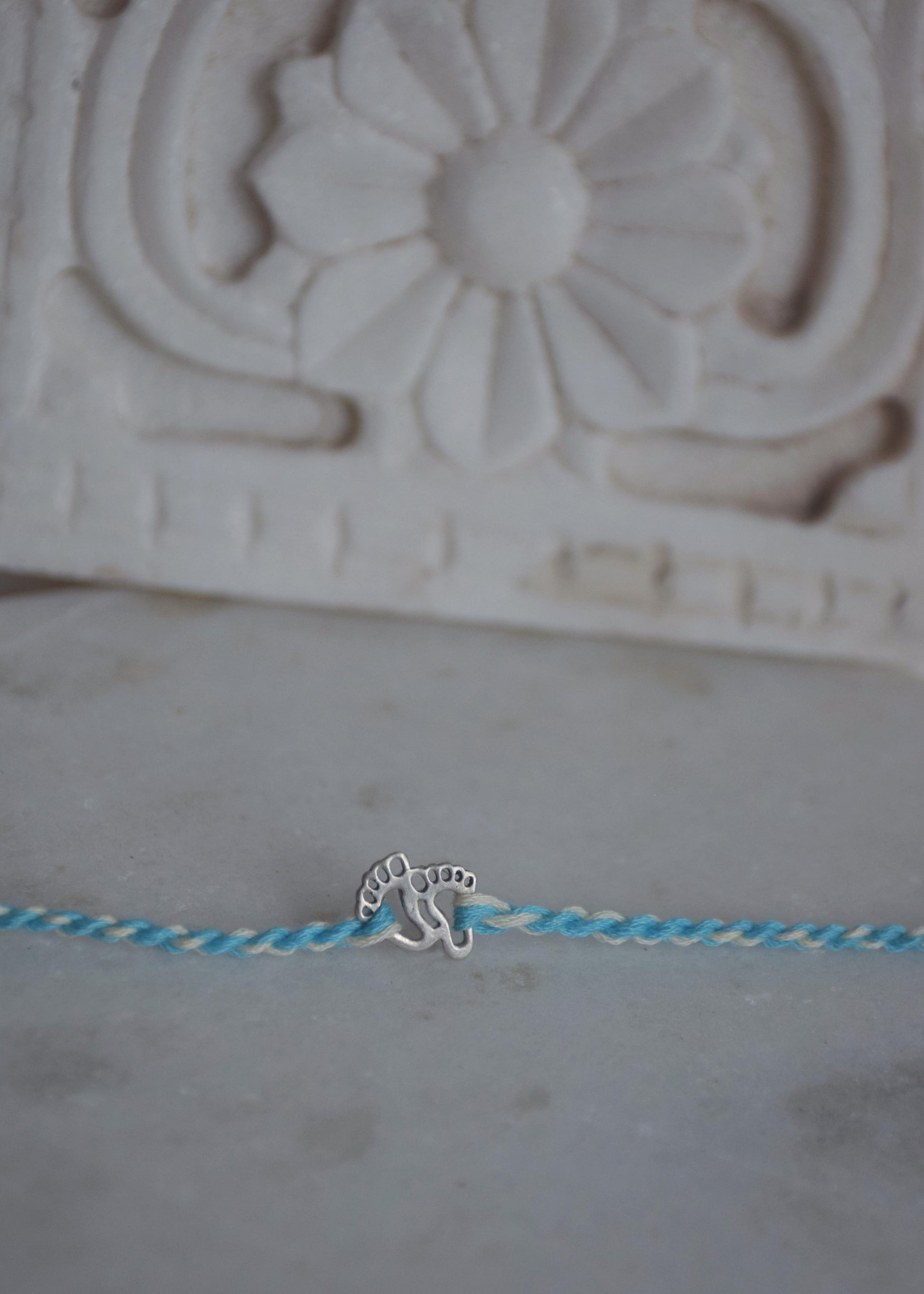 925 sterling silver kids rakhi with cute baby feet design