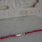 92.5 sterling silver Rakhi featuring real freshwater pearls and cotton thread,