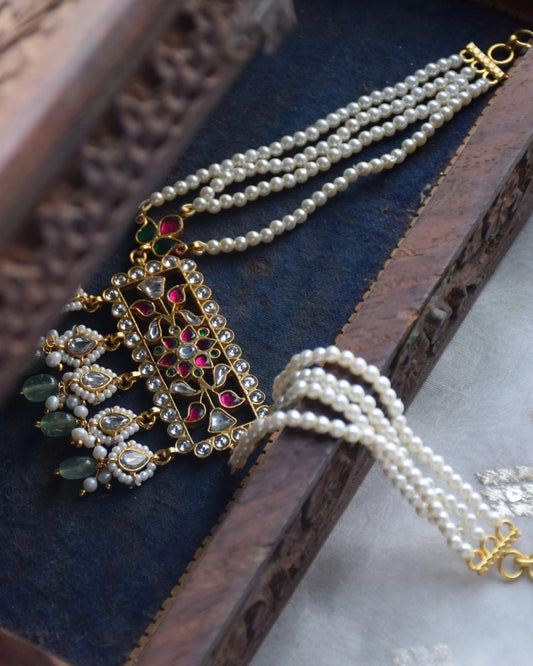 Aayat Choker handcrafted in 925 silver with radiant gold polish, featuring a chic rectangular design inspired by Rajasthani Aad necklaces. Adorned with vibrant multi-colored Jadau stones