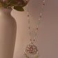 Elegant jadau necklace featuring tumbled Jadau White and Pink Stones in pearls on a delicate chain, with a finely studded jadau centerpiece and freshwater pearl hangings
