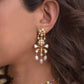 Matwaari Earrings crafted in 925 silver with gold polish, featuring a chandelier design with a stud embellished in white Jadau polkis and cascading rice pearls.