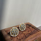 Mogra Jadau Earstuds in 925 silver with gold polish, featuring a floral design of seven round jadau stones and a seed pearl border.
