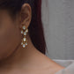 Nargis Earrings crafted in 925 silver, featuring exquisite chandelier-style Polki stone drops that shimmer beautifully. These delicate and elegant earrings.