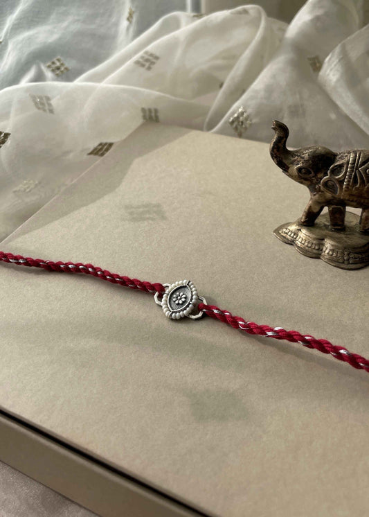 Beautiful 92.5 sterling silver Rakhi crafted with sterling silver and cotton thread