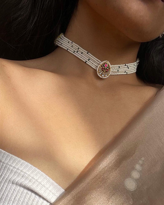 Alt Text:
Pankhudi Choker handcrafted in 925 silver with gold polish, featuring a central petal unit adorned with multicolored jadau stones and delicate pearl accents.