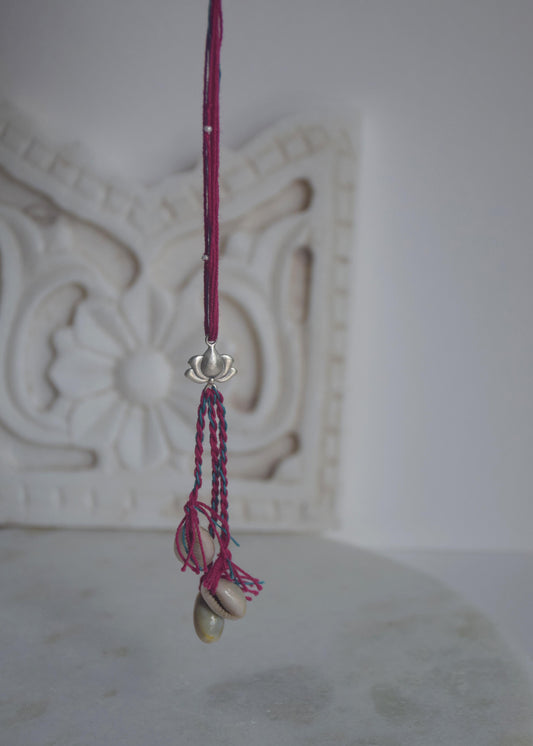  92.5 sterling silver Rakhi featuring real freshwater pearls and cotton thread,
