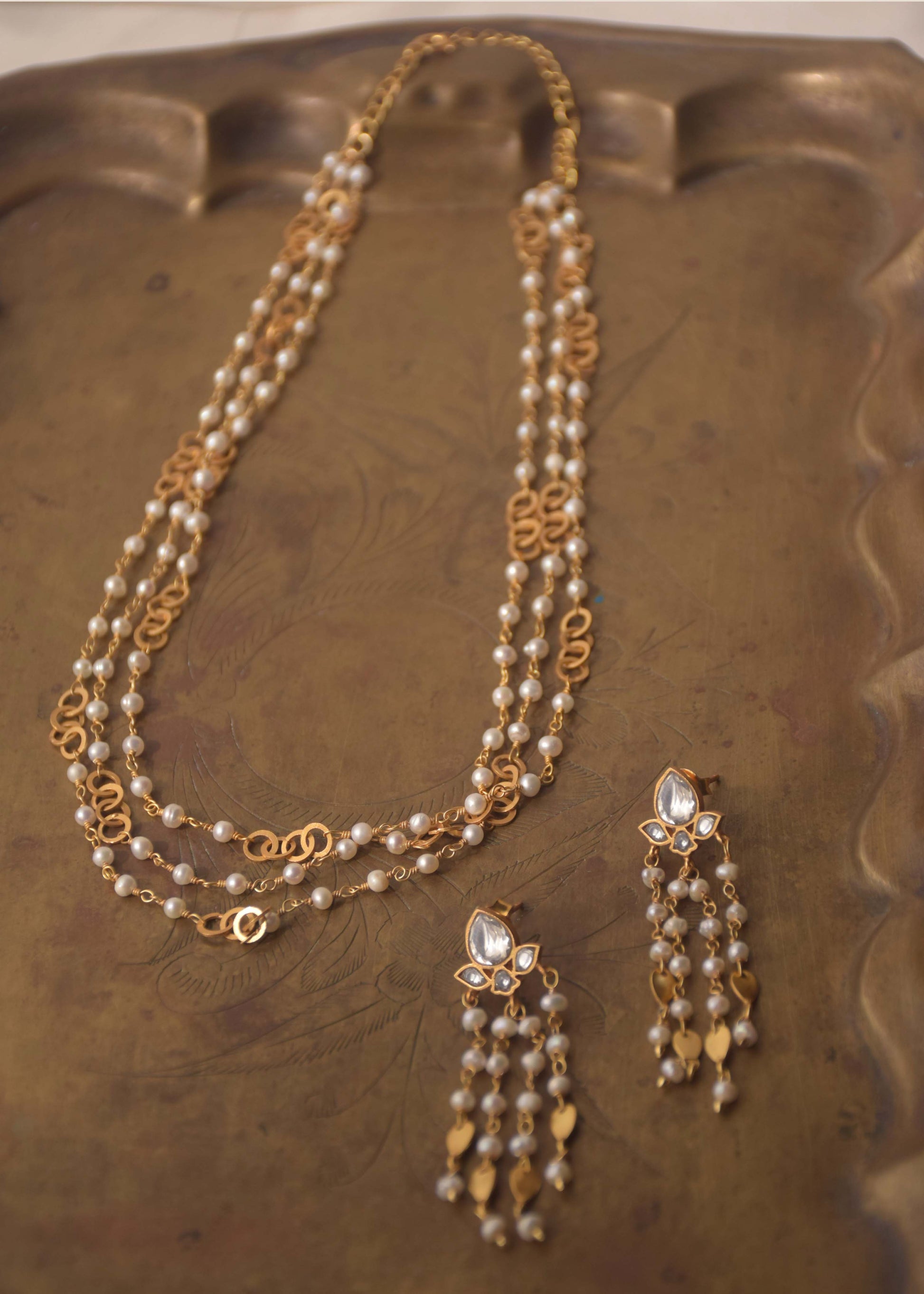 Three-layer silver pearl necklace with circular link work, handcrafted by NUVI JEWELS
