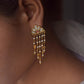 925 sterling silver gold-plated earrings featuring a floral Jadau motif with subtle color, cascading freshwater pearls, and a delicate golden leaf, creating a light, feminine, and timeless design