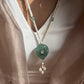 Navya long necklace handcrafted in 925 silver featuring a hand-carved green quartz pendant with polki detailing, elegantly strung on a freshwater rice pearl mala.