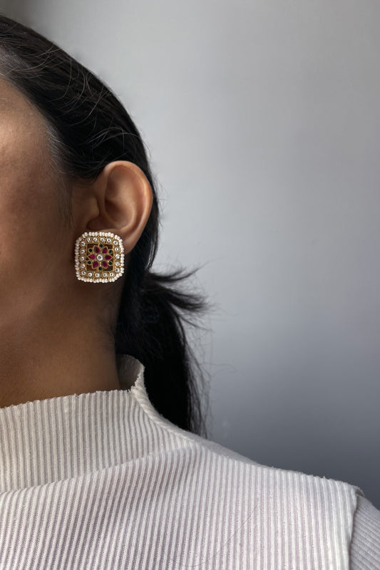 Aayat 925 silver square earstuds adorned with multicolored Jadau stones and bordered with delicate seed pearls.
