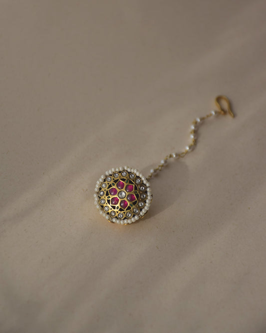 Aneri Borla handcrafted in 92.5 sterling silver featuring vibrant Jadau stones and a delicate line of seed pearls.
