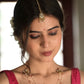 Traditional Suratiya Maangtika crafted in 925 silver, showcasing a timeless chaand design with delicate rice pearls and green aventurine accents.Latest Designer Silver Jewellery Online in India
