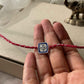 Premium Blue Meena 925 Silver Rakhi crafted with detailed blue meenakari work and refined sterling silver artistry.