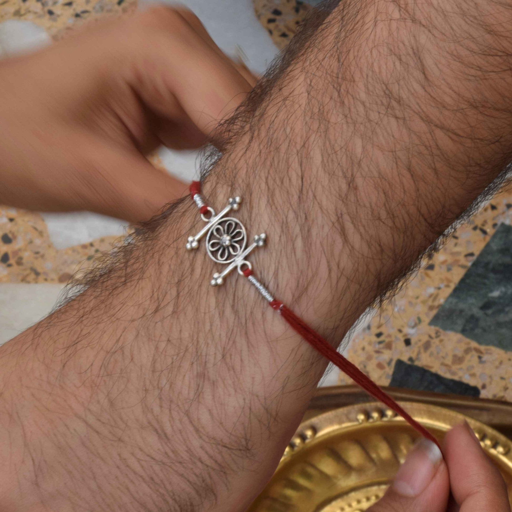 Premium Flower 925 Sterling Silver Rakhi crafted with intricate flower detailing and elegant festive artistry for meaningful gifting.